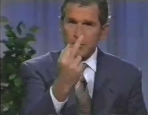 President Bush, in an undoctored press conference photo, 
flips off the media